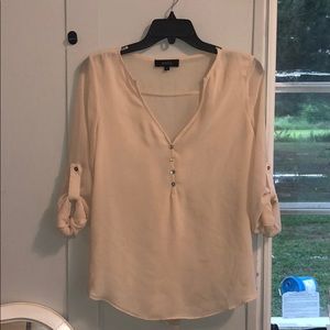 Beige blouse with buttons